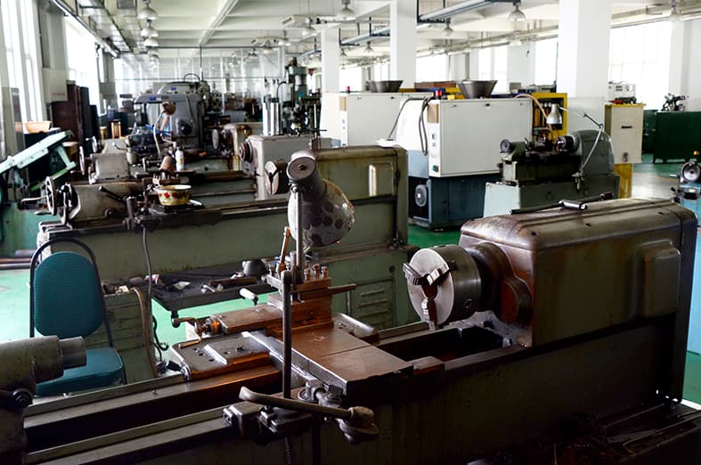 Rows of machining equipment in the Compas production workshop.