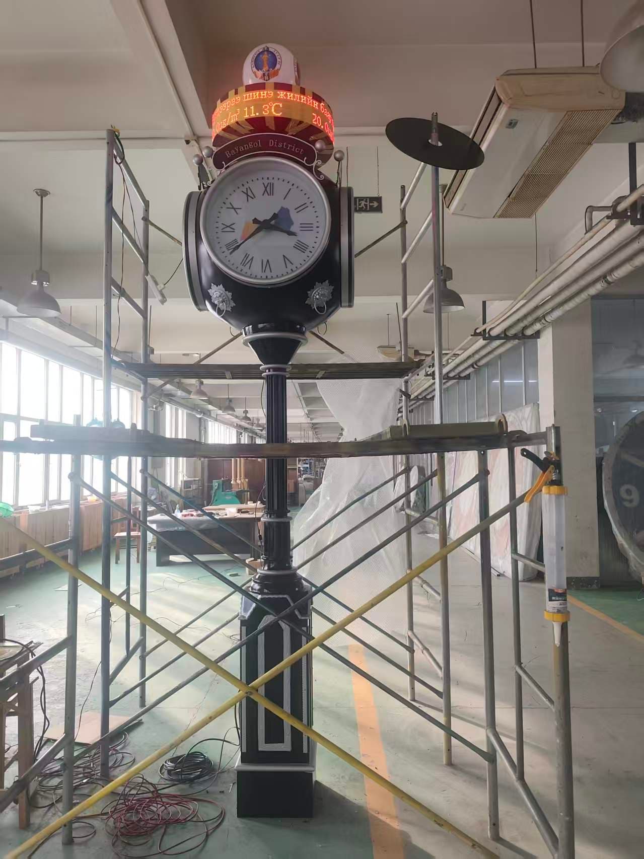 Indoor landscape clock with an illuminated information display.