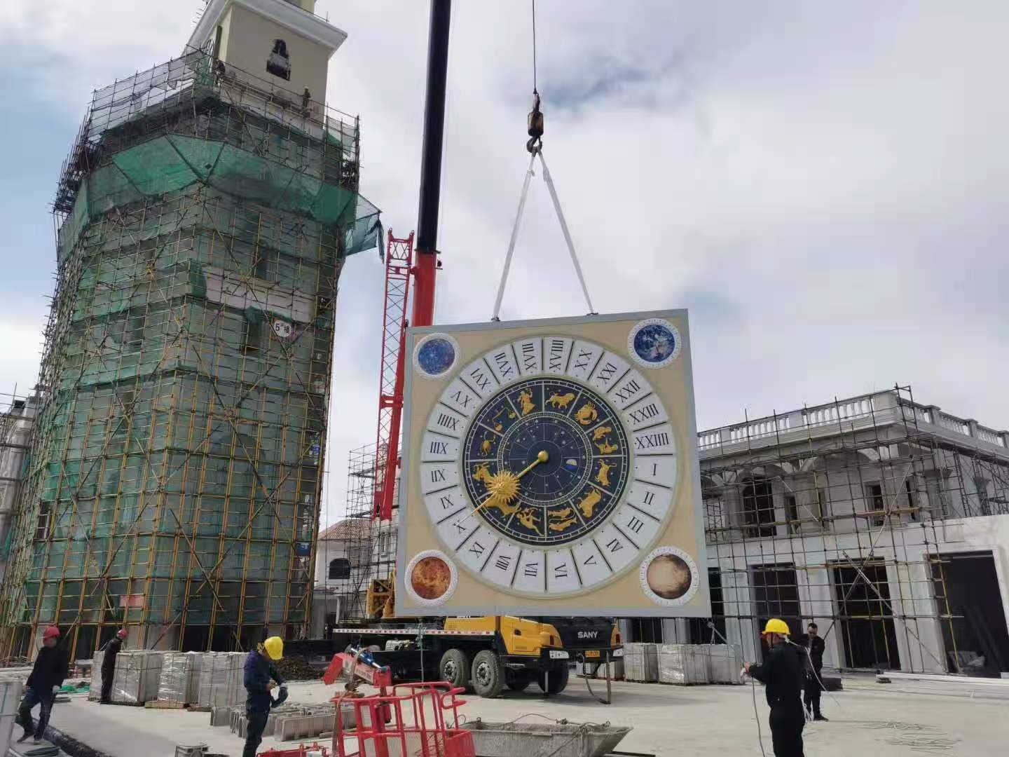 Astronomical clock being lifted into place at Jiangsu Chunfeng Town.