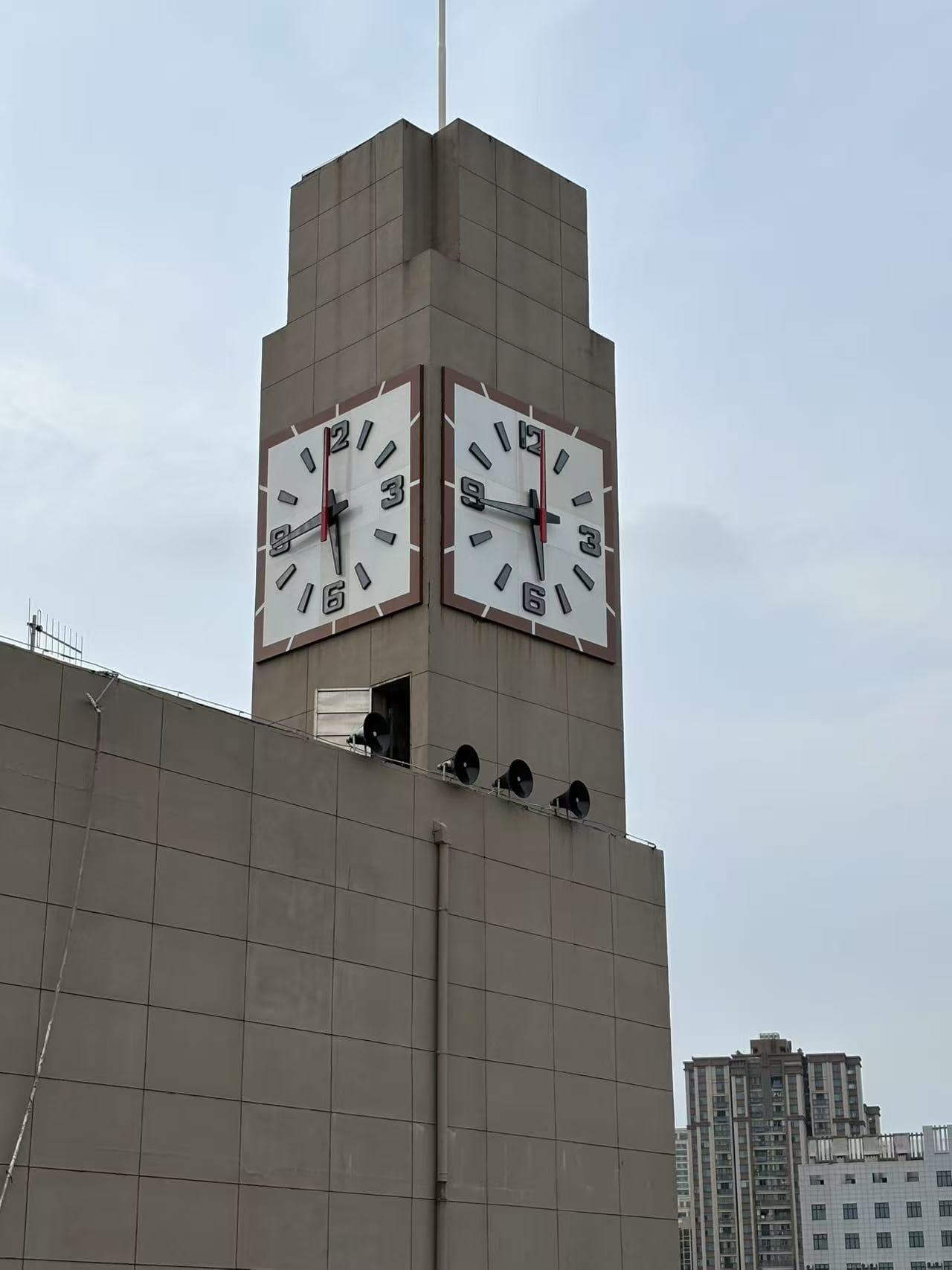 Four-sided tower clock at Wuhan Polytechnic University.