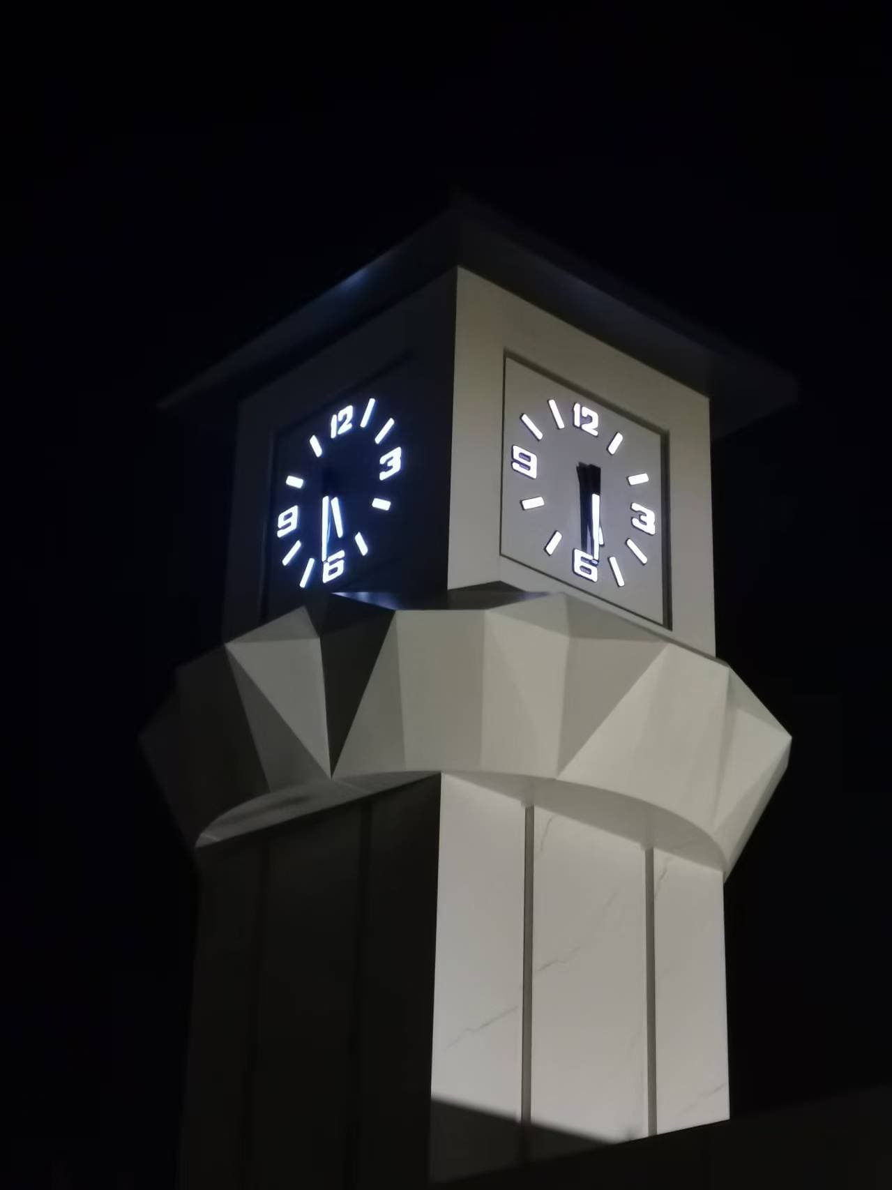 Illuminated tower clock at Hebei Construction Company.