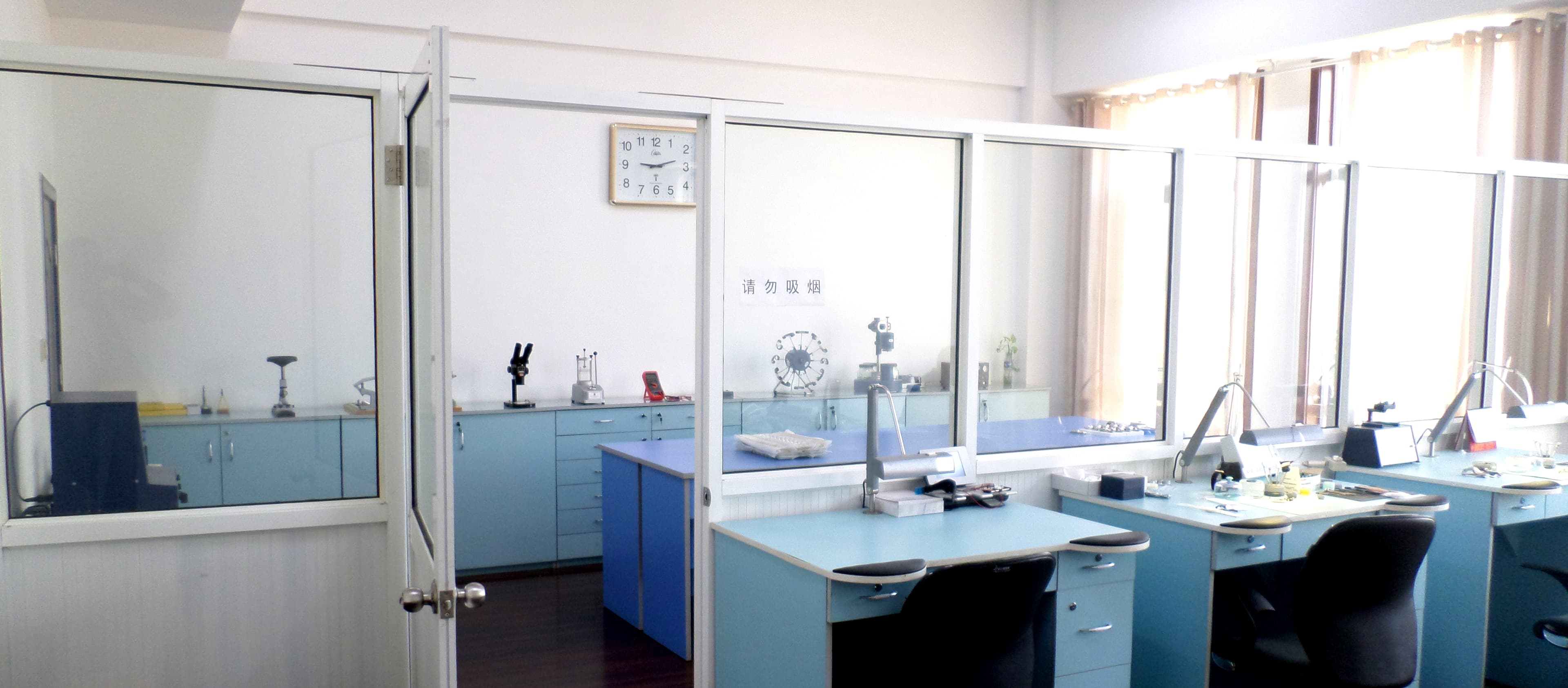 Wall-mounted digital clocks being tested in a laboratory environment.